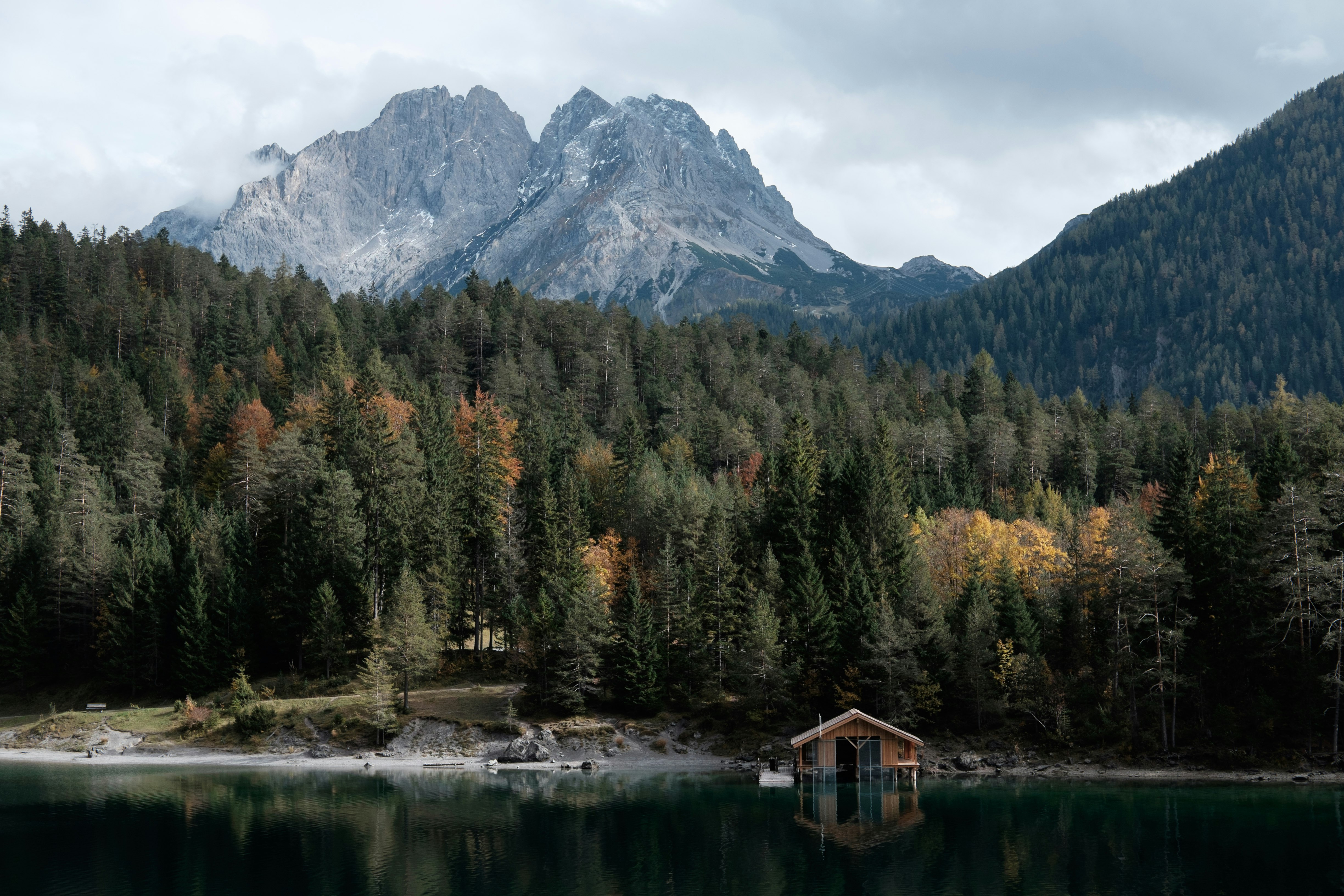 body of water in front of mountain during daytime